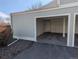 Attached garage with ample storage space and a side door at 8791 Chase Dr # 220, Arvada, CO 80003