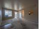 Spacious living room with carpet, natural light, and an open view into the dining area at 8791 Chase Dr # 220, Arvada, CO 80003