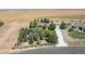 An aerial view showcasing this home's lush landscaping and convenient access to local roads at 18399 Wagon Trl, Mead, CO 80542