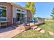 Inviting back deck features an outdoor grill, patio furniture, and steps to the backyard at 18399 Wagon Trl, Mead, CO 80542