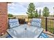 Cozy deck with a table, comfortable seating, and views of the open fields at 18399 Wagon Trl, Mead, CO 80542