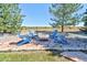 Backyard area with firepit and Adirondack chairs; perfect for outdoor enjoyment at 18399 Wagon Trl, Mead, CO 80542