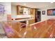 Basement bar with wooden counter, glass cabinets, neon signs, and stainless-steel appliances at 18399 Wagon Trl, Mead, CO 80542