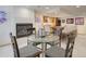 Finished basement with a fireplace, bar area, table with chairs and neon signs at 18399 Wagon Trl, Mead, CO 80542