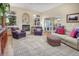 Comfortable living room with a fireplace, hardwood floors, and ample seating at 18399 Wagon Trl, Mead, CO 80542