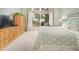 Main bedroom featuring large window, dresser, TV, and neutral decor at 18399 Wagon Trl, Mead, CO 80542