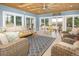 Beautiful porch with wood ceiling, comfortable seating, and a welcome sign at 18399 Wagon Trl, Mead, CO 80542