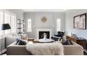 Bright living room with a modern fireplace, sleek furniture, and stylish decor accents at 1675 Newport St, Denver, CO 80220