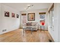 Bright and airy living room featuring hardwood floors, neutral tones, and ample natural light at 20875 E Girard Pl, Aurora, CO 80013