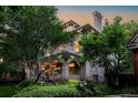 Beautiful home showcasing lush greenery, an inviting front porch, and classic architectural details at 780 N Lafayette St, Denver, CO 80218