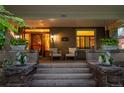 Inviting front porch with seating, elegant swan planters, and a beautifully designed front door at 780 N Lafayette St, Denver, CO 80218