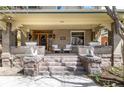 Inviting front porch with comfortable seating and decorative planters, creating a cozy outdoor living space at 780 N Lafayette St, Denver, CO 80218