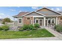 Charming single-story home with stone accents and landscaped front yard at 12940 Jasmine St # A, Thornton, CO 80602