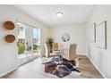 Bright dining area featuring sliding glass doors and modern decor at 10520 W Fair Ave # A, Littleton, CO 80127