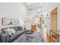 Bright, open living space with high ceilings and stylish decor at 10520 W Fair Ave # A, Littleton, CO 80127