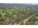 High-angle view of property surrounded by forest at 2378 Hearth Dr # 20, Evergreen, CO 80439