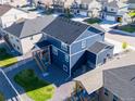 Backyard aerial view featuring a white fence, gravel landscaping, and a private back porch at 4851 Cattle Cross Rd, Castle Rock, CO 80104