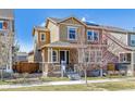 Charming two-story home with a welcoming front porch and professionally landscaped front yard at 7367 S Pennsylvania St, Littleton, CO 80122