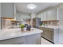 Modern kitchen with stainless steel appliances and updated cabinets at 3813 E 121St Ave, Thornton, CO 80241