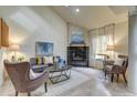 Bright living room with hardwood floors and fireplace at 3813 E 121St Ave, Thornton, CO 80241