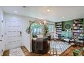 Spacious living room with hardwood floors and built-in bookcases at 6403 Zang Ct, Arvada, CO 80004