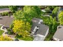 Aerial view of a well-maintained home with lush greenery, mature trees, and a manicured lawn at 3235 E Easter Pl, Centennial, CO 80122