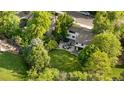 A high-angle aerial view showcases the home's deck, patio, and expansive yard at 3235 E Easter Pl, Centennial, CO 80122