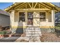Close up of the front of the house showing the porch and front door at 2421 Hooker St, Denver, CO 80211