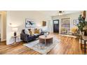 Comfortable living room with hardwood floors, a gray sofa, and natural light at 2421 Hooker St, Denver, CO 80211