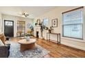 Bright living room featuring hardwood floors, a fireplace, and stylish decor at 2421 Hooker St, Denver, CO 80211