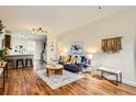 Cozy living room with stylish decor, hardwood floors, and an open layout at 2421 Hooker St, Denver, CO 80211