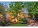 Landscaped backyard featuring a decorative fountain and lush greenery, perfect for relaxation at 5530 E 6Th Avenue Pkwy, Denver, CO 80220
