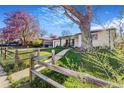 This home is a charming single-story with beautiful yard, and classic front porch at 135 Garnet St, Broomfield, CO 80020