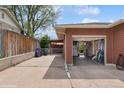 View of garage and driveway, featuring a spacious area for parking and storage at 2792 S Stuart St, Denver, CO 80236