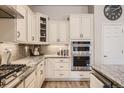 Well-equipped kitchen features stainless steel appliances, ample cabinet space, and sleek countertops for cooking and entertaining at 21985 E Bailey Pl, Aurora, CO 80016