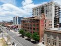 Exterior shot featuring a commercial building, showcasing its brick facade, and surrounding urban landscape at 2000 Arapahoe St # 305, Denver, CO 80205