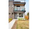 Charming modern home with a private balcony, stone accents, and meticulous front yard at 2231 W 36Th Ave, Denver, CO 80211
