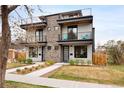 Stunning modern duplex with multiple balconies, stone accents, and well-maintained landscaping at 2231 W 36Th Ave, Denver, CO 80211