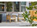 Inviting front porch featuring cozy seating, perfect for enjoying the outdoors at 1702 W 66Th Ave, Denver, CO 80221