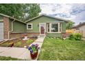 Charming single-Gathering home featuring a beautiful garden, mature trees, and an attached two-car garage at 10462 Hoyt St, Westminster, CO 80021