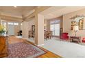 Spacious living room featuring elegant decor and hardwood floors at 3494 S Otis Ct, Lakewood, CO 80227