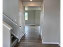 Entryway leading to living area featuring durable plank flooring at 1783 Jennifer St, Brighton, CO 80601