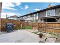 Private backyard with patio and grill area, perfect for entertaining at 3855 S Monaco St # 170, Denver, CO 80237