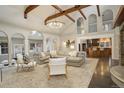 Bright and airy living room with vaulted ceilings, exposed beams, and an open floor plan at 1036 Lexington Ave, Westminster, CO 80023