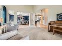 Open-concept layout with views to the dining area and the staircase leading to the second level at 13901 Quail Ridge Dr, Broomfield, CO 80020