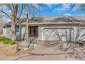 Charming front exterior features an attached garage, and accessible ramp at 2840 S Heather Gardens Way # A, Aurora, CO 80014