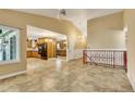 Open-concept layout with tile flooring connecting the living room, dining area, and kitchen at 2840 S Heather Gardens Way # A, Aurora, CO 80014