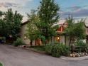 Charming home with mature trees and natural landscaping, offering curb appeal and a serene setting at 109 Bear Creek Ln, Morrison, CO 80465