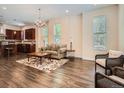 Open-concept living area with hardwood floors connecting the kitchen and living spaces at 2775 California St, Denver, CO 80205