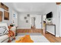 Bright and airy living room with hardwood floors and stylish decor at 4455 Brentwood St, Wheat Ridge, CO 80033